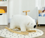 Cheval à bascule ours polaire fonction sonore poignée bois peluche blanc