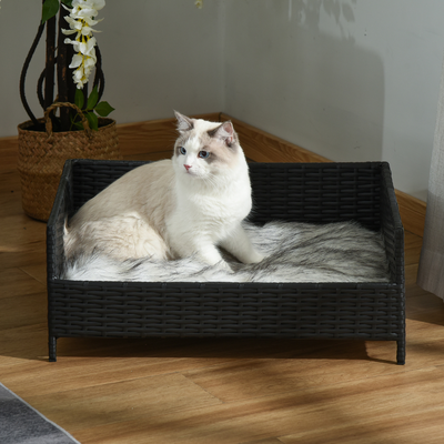 Canapé chien chat style cosy chic noir avec coussin fourrure blanc gris